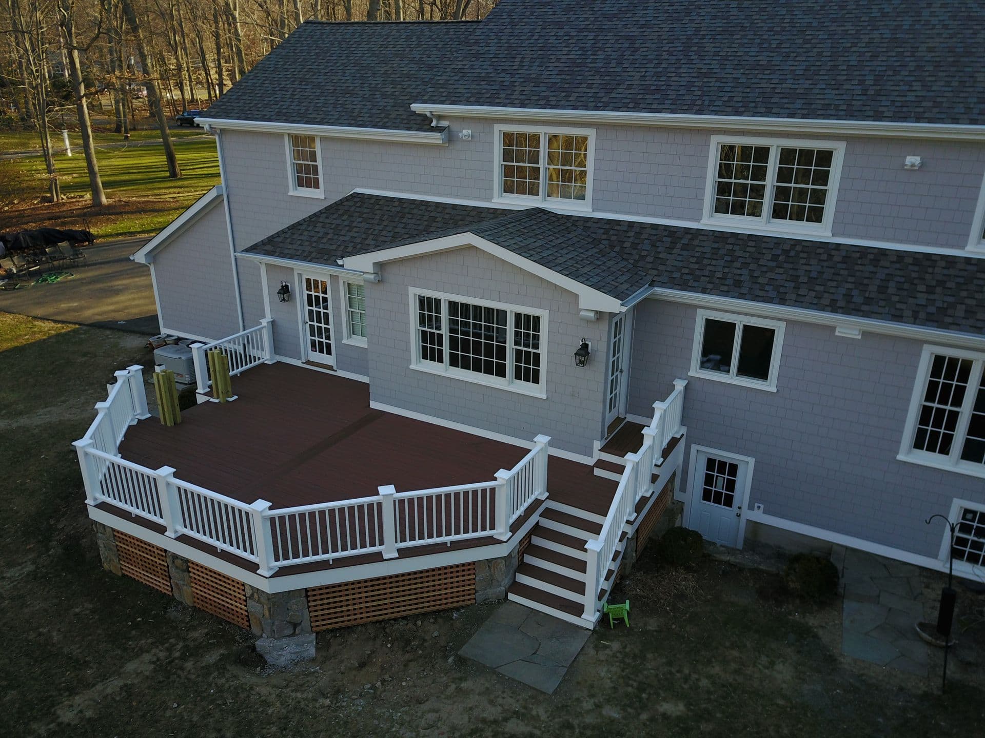 Finished deck with huge house